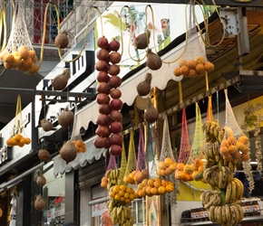 Hanging fruit above the sidewalk in Amman