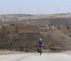 Neil with Shawbek Castle in the background (and distant wind turbines)