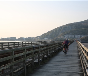 The bridge into Barmouth is shared with the railway line and no cards. It's a bumpy ride over the wooden planks with great water views to the right