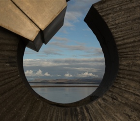 Distint hills seen through the Brákin Monument in Borganes. 