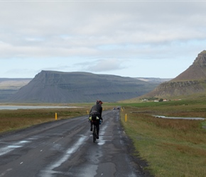 Rachel heading up the coast road. At the end it would bear right to start the climb