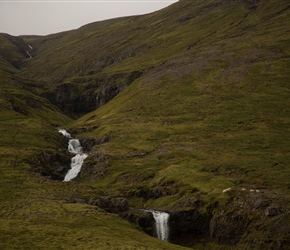 Sheep crossing the waterfall on the climb