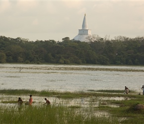 Bathers and across the water lies Sanda Hiru Seya