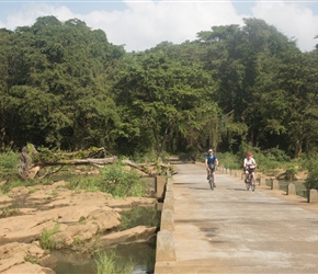 Linda and Robin cross the Mehaweli Ganga on a causeway. This was just after a tricky turn that a few missed (that's another story) Yu could see the dam to the right