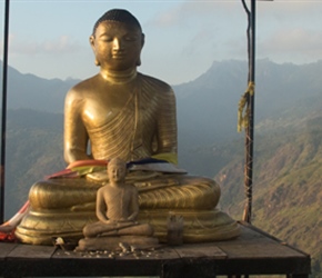 The buddha turned yellow in the morning sunrise on Little Adams Peak