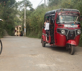 Karen takes a picture of the small girl in a tuk tuk