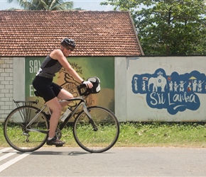 Karen passes a welcome to Sri Lanka mural