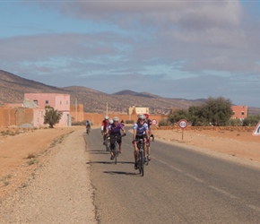 Lynne on the road to Bounnamane. This was a long road that although slightly uphill felt flat