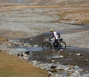 Kath crosses the Black Goat River, next to which we would camp for the night. The water level was thankfully low as sometimes it comes over the axles of the vans that cross it