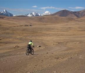 Lora sets out from the campsite, you can just see the peaks