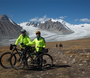 David and Christine in front of Khüiten Peak and glacier