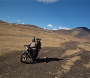 Boghi hadn't seen Khüiten Peak and its glacier, so a local took her up on his motorbike. Here she passed us waving on the way down