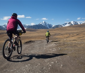 Claire and Peter start the ascent through the National Park towards in front of Khüiten Peak and its glacier