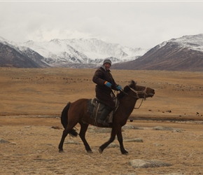 Having been thoroughly amused by cycle tourists, the shepherd takes of on his horse