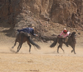 Bushkashi – Tug of war played on horseback with goatskin. The first competitor picked up the goat from the floor, the second the other end. They then tustled whilst riding, often at high speed. The last to release wins