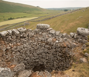 Worth a climb to look inside an old Lime Kiln. A track led to this stone lined pit where the local limestone was heated