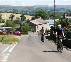 Neil exits village and climbs