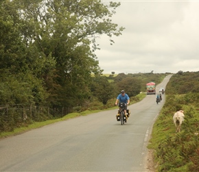 Lovely views to the right over Plymouth as Andy descends from an ancient cross on Dartmoor