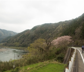 The two Sue's head along the Shimanto River in matching Cycling Japan attire