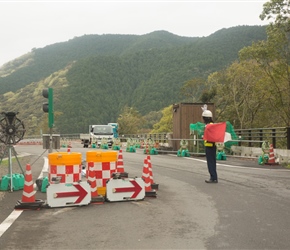 Anywhere there were roadworks or the slightest danger there would be a person with a flag. Red for NO, White for YES