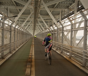 Sue and her banner cross Innoshima Bridge