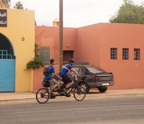 The joy of these trips is that very often we cycled through places unvisited by tourists. With a spare saddle Andy obliged to give the locals a go