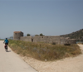 Sharon passes the outer walls to Butrint, just before the ferry