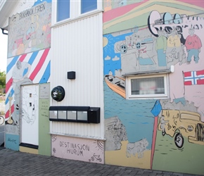 Josie passes a mural